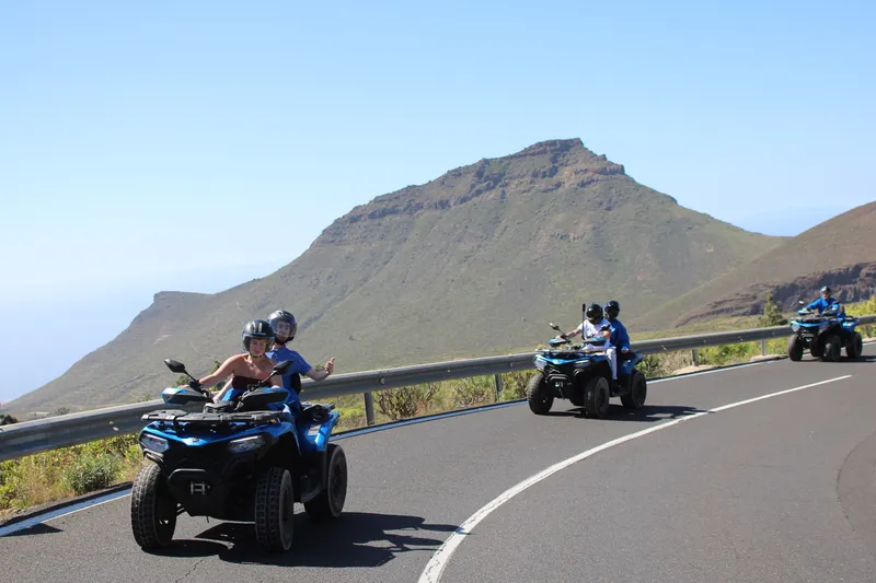 Tenerife quad tour group stopping at mountain trail viewpoint