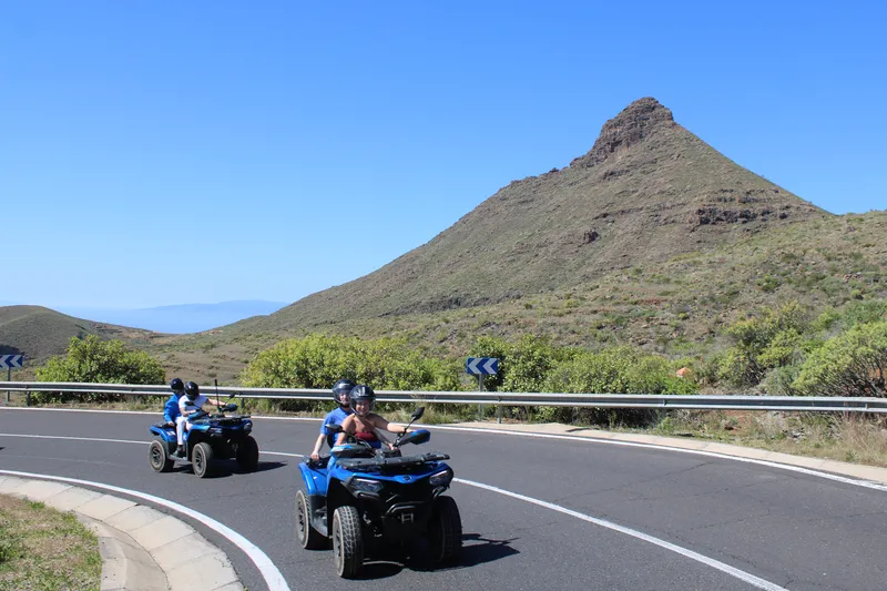 Quad bikes parked in a line with Mount Teide peak backdrop
