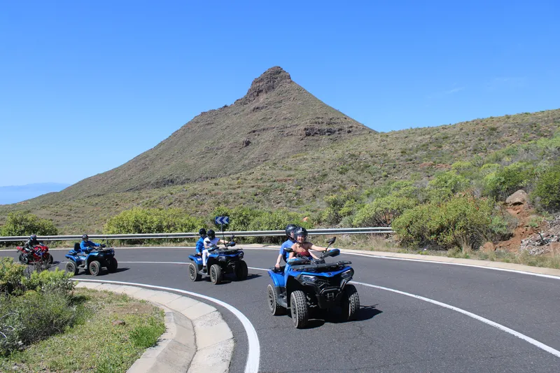 Couples enjoying volcanic landscape quad biking tour in Tenerife