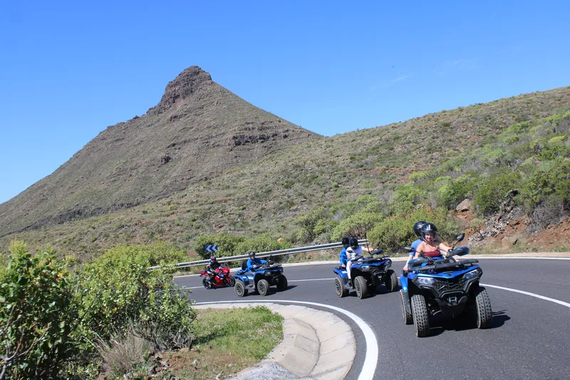 Spectacular panoramic view of Teide peak with quad tour riders