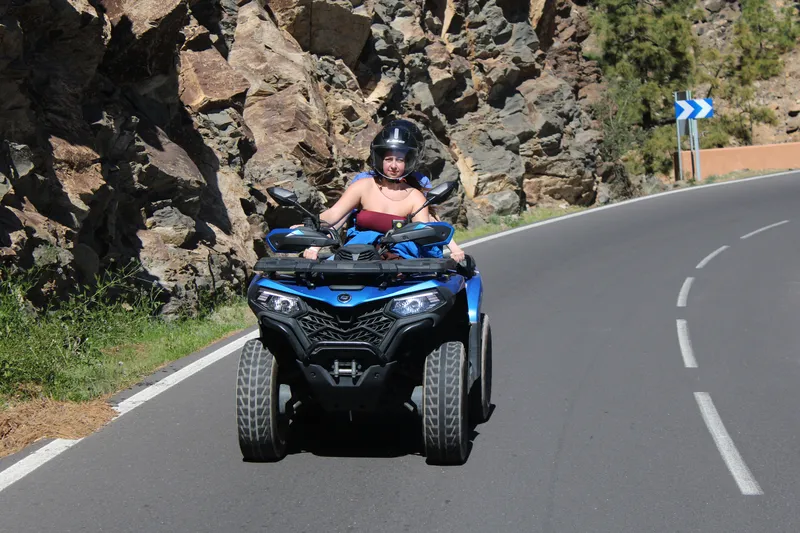 Quad biking adventure group during scenic mountain stop