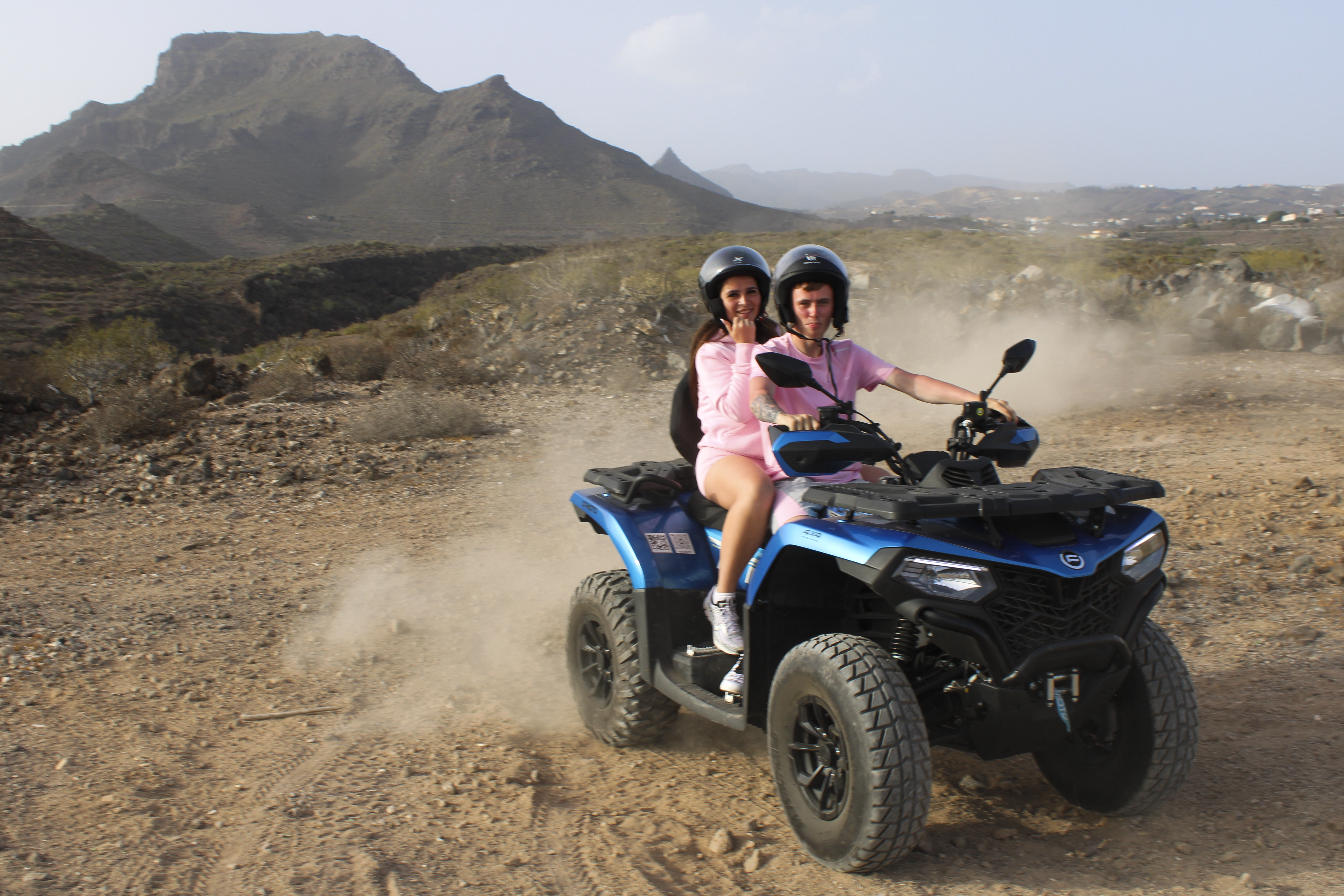 Premium quad bikes lined up on a scenic mountain road in Tenerife